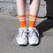 Оранжевые носки с белыми полосками