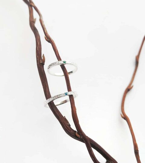 Textured ring with green cubic zirconia