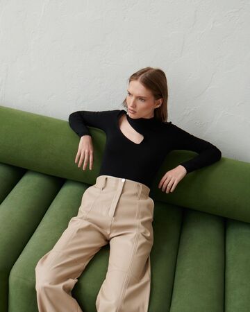 Black bodysuit with a slit on the shoulder