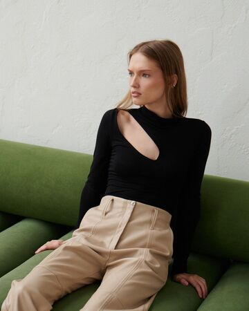 Black bodysuit with a slit on the shoulder