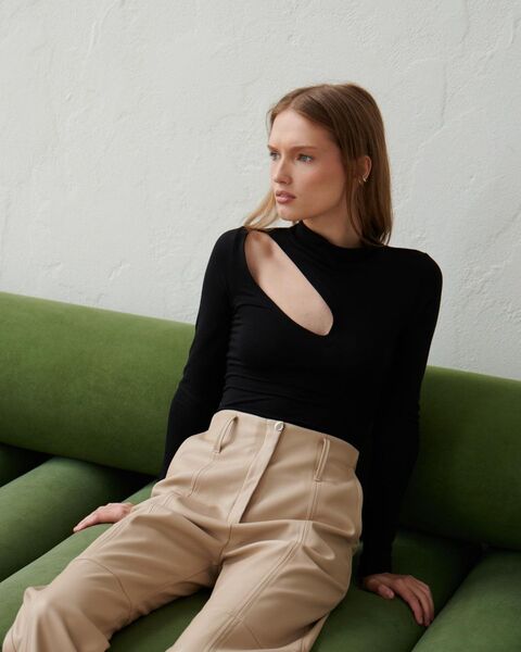 Black bodysuit with a slit on the shoulder