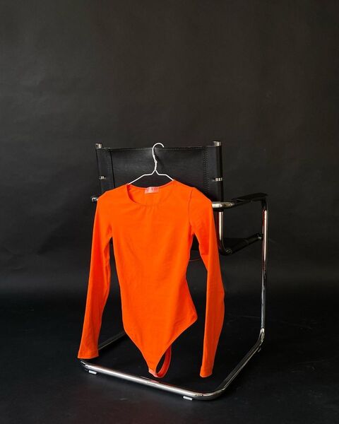 Orange bodysuit with an open back