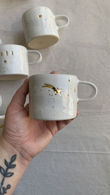 White cup with shooting star