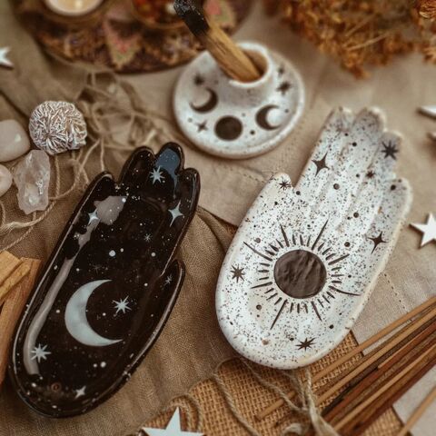 Black palm with the painting of the Moon