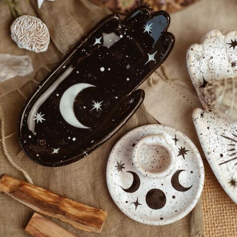 Black palm with the painting of the Moon