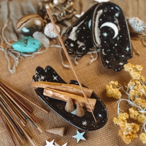 Black palm with the painting of the Moon