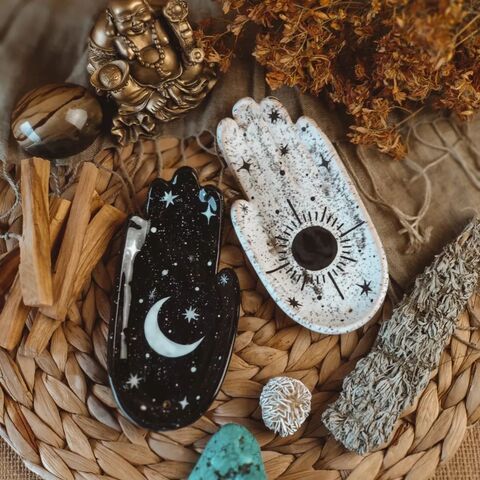 Black palm with the painting of the Moon