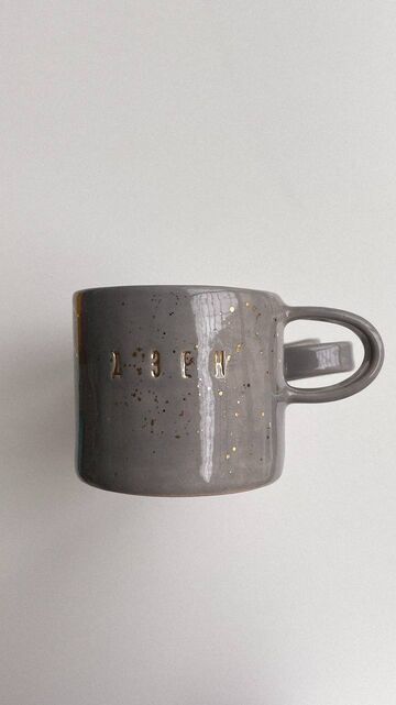 Gray cup with gold Zen