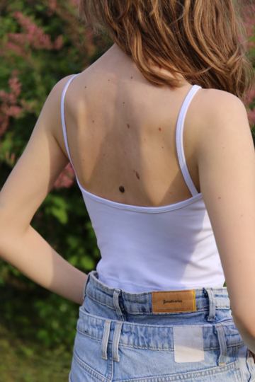 White top with two stripes