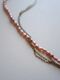 Necklace with pink beads and silver chain