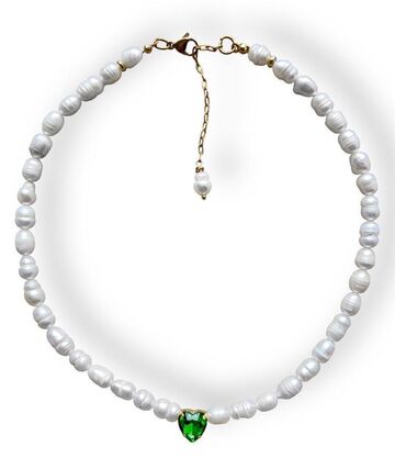 A pearl necklace with a green heart
