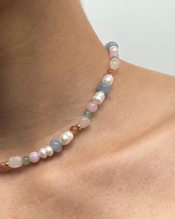 A necklace of pearls and colored stones