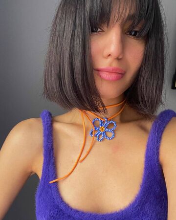 A blue flower on an orange string