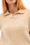 Beige knitted polo shirt with long sleeves