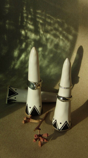 A large white cone with black triangles