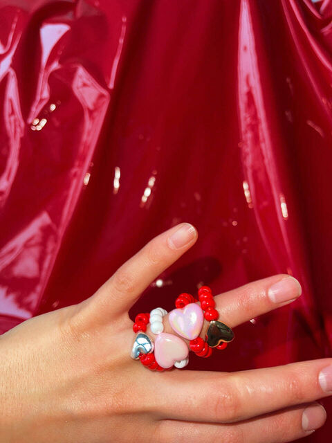 A red ring with a silver heart