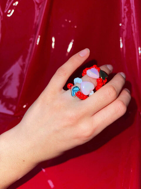 A red ring with a silver heart