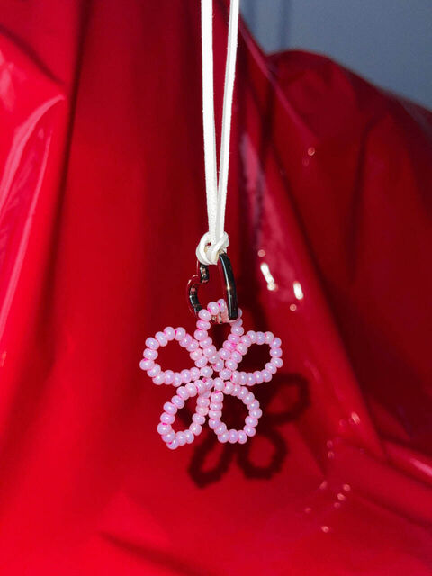 Necklace with a pink flower and a carabiner