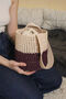 Bucket bag in wine-straw color