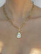 Asymmetric pearl pendant chain in gold