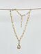 Asymmetric pearl pendant chain in gold