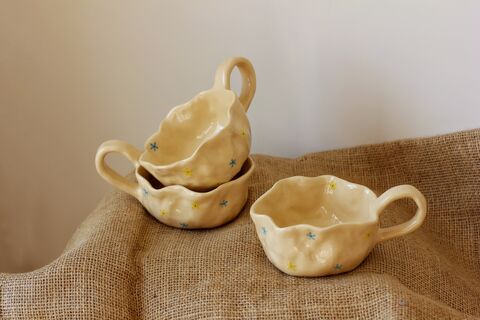 Cup with yellow and blue flowers