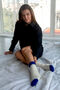 Hand-knitted socks made of natural wool beige with electric blue