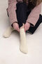 Hand-knitted socks made of natural wool beige