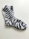 Hand-knitted socks made of natural wool white with black