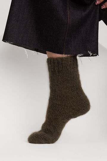 Hand-knitted socks made of natural wool green