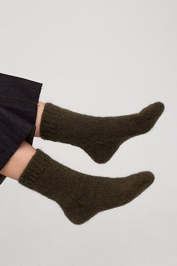 Hand-knitted socks made of natural wool green