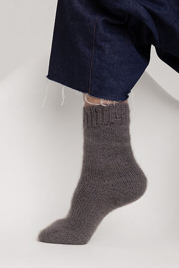 Hand-knitted socks made of natural wool grey