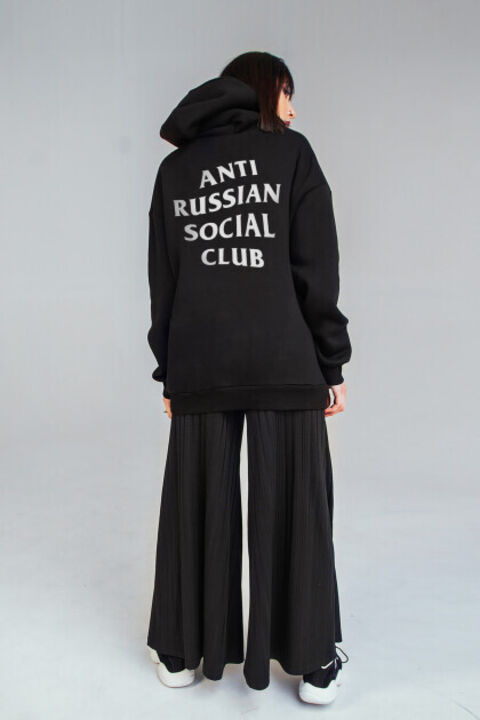 Black oversized ARSC hoodie with a white logo on the back