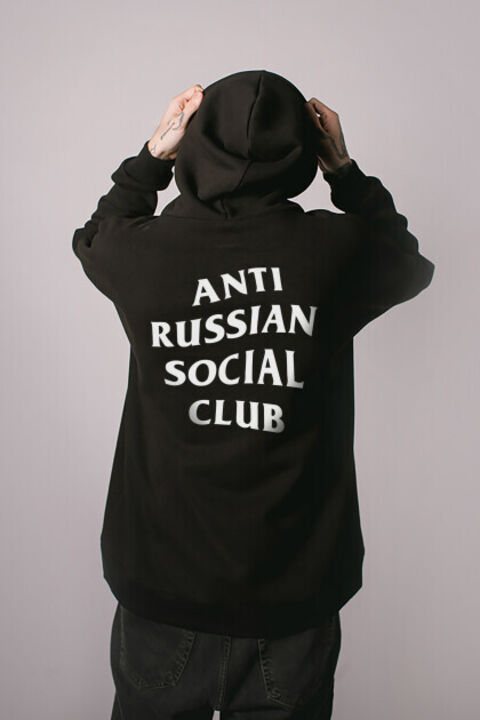 Black oversized ARSC hoodie with a white logo on the back