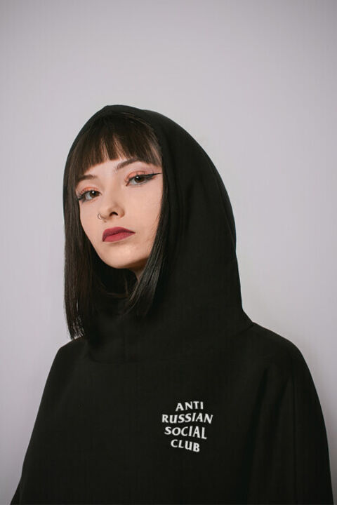 Black oversized ARSC hoodie with a white logo on the back