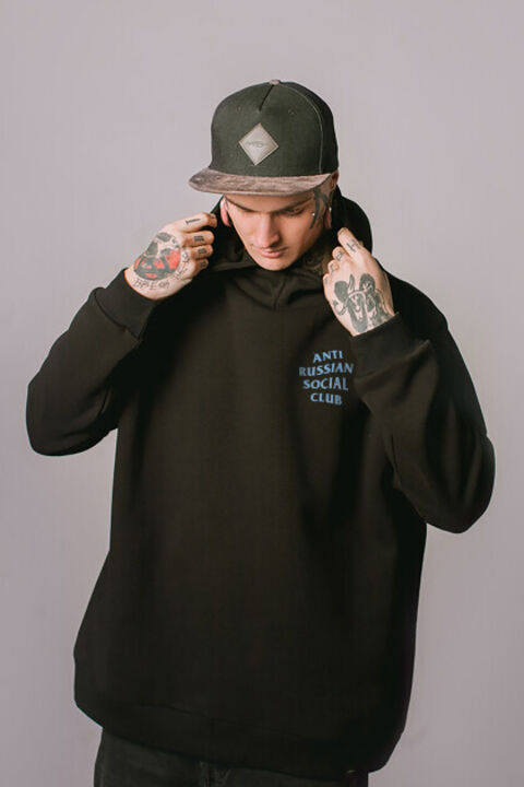 ARSC black oversized hoodie featuring a light blue back logo