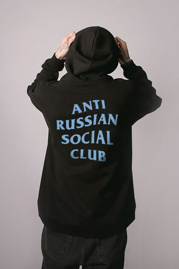 ARSC black oversized hoodie featuring a light blue back logo