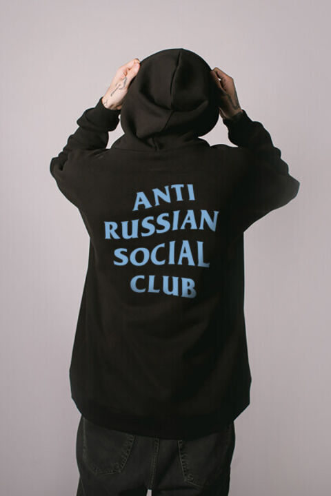 ARSC black oversized hoodie featuring a light blue back logo