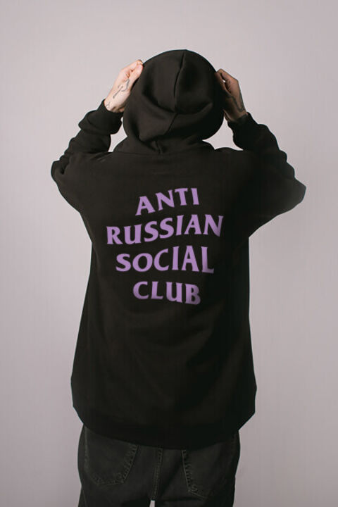 ARSC black oversized hoodie featuring a lavender back logo