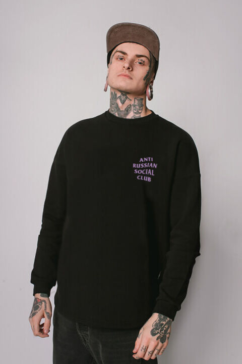 Black oversized ARSC sweatshirt with lilac logo on the back
