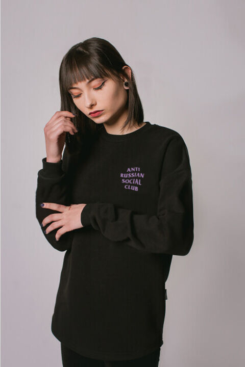 Black oversized ARSC sweatshirt with lilac logo on the back