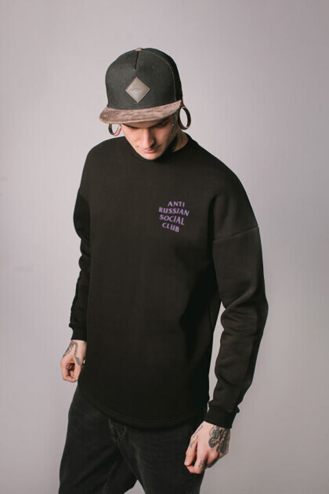 Black oversized ARSC sweatshirt with lilac logo on the back