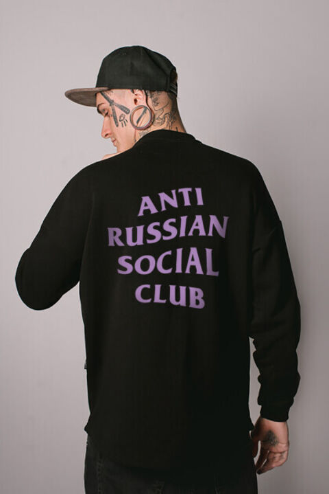 Black oversized ARSC sweatshirt with lilac logo on the back