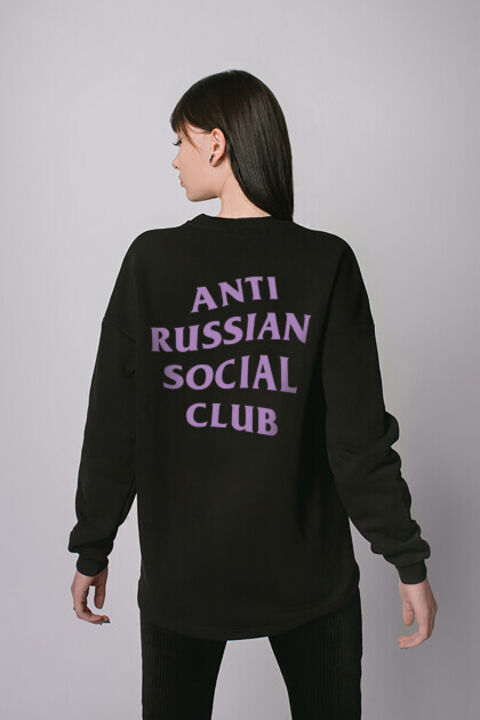 Black oversized ARSC sweatshirt with lilac logo on the back