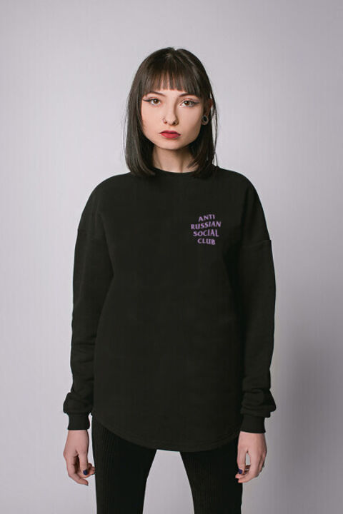 Black oversized ARSC sweatshirt with lilac logo on the back