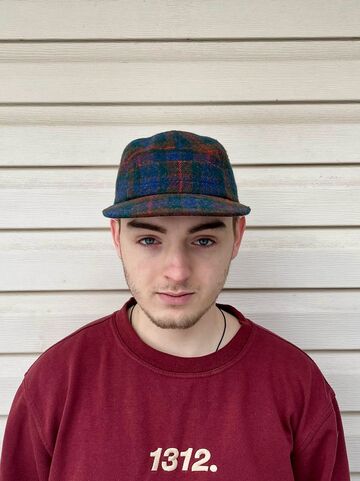 Dark blue checkered cap with a pocket