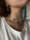 Shell necklace with ceramic bead