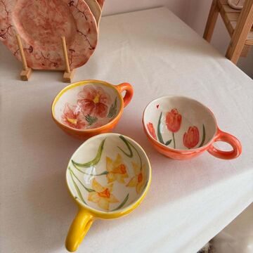 Yellow cup with daffodils