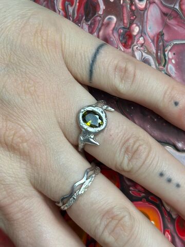 Ring with olive cubic zirconia